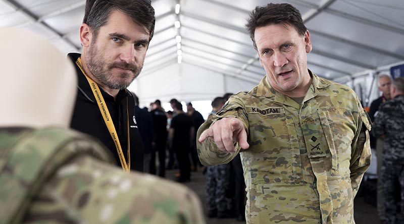 Head of Military Strategic Plans Major General Colin Karotam talks with defence industry professionals during Exercise Autonomous Warrior 2022 at HMAS Creswell, Jervis Bay, Australian Capital Territory. Photo by Leading Seaman Ryan Tascas.