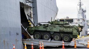 A New Zealand Army Light Armoured Vehicle embarks on HMNZS Canterbury, at Wellington’s CentrePort, to sail as part of New Zealand's advance contingent to Australia for Exercise Talisman Sabre 25. NZDF photo.