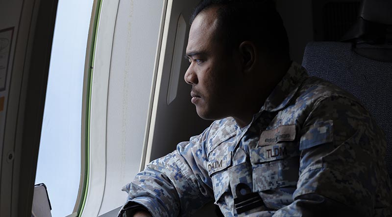 Tentera Laut Diraja Malaysia (Royal Malaysian Navy) Observer Lieutenant Dain monitors shipping movements onboard an Australian P-8A Poseidon during a sortie on Operation Gateway 25-1/2. Photo by Sergeant Craig Barrett.
