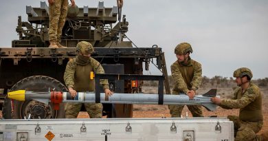 Soldiers from the 16th Regiment, Royal Australian Artillery, load Sidewinder missiles on a NASAMS High-Mobility Launcher at Woomera Test Range, South Australia. Story and photos by Corporal Jacob Joseph.