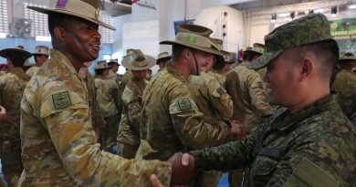 Philippine Army and Australian Army soldiers shake hands after the Australians were presented with patches of the Philippines’ 4th Infantry Division during the closing ceremony of Ex Kasangga at Camp Evangelista in Northern Mindanao. Story and photos by Warrant Officer Class 2 Max Bree
