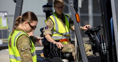 Royal Air Force aviator Air Specialist (Class 1) Kate Oldershaw operates a forklift while working with RAAF aviator Leading Aircraftwoman Georgia Dewhirst during Exercise Talisman Sabre. Story by Flight Lieutenant Imogen Lunny. Photos by Leading Aircraftwoman Nell Bradbury.