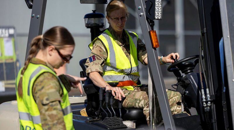 Royal Air Force aviator Air Specialist (Class 1) Kate Oldershaw operates a forklift while working with RAAF aviator Leading Aircraftwoman Georgia Dewhirst during Exercise Talisman Sabre. Story by Flight Lieutenant Imogen Lunny. Photos by Leading Aircraftwoman Nell Bradbury.