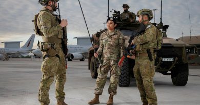 From left, Corporal Dillon Walker, of 2 Security Forces Squadron, talks to Senior Airman Brittany Palomo, of the US Air Force, and Leading Aircraftman John Stratford, of 13 Squadron Security Forces, on the flight line at RAAF Base Darwin. Story by Flight Lieutenant Kayla Walliss. Photos by Sergeant David Gibbs.