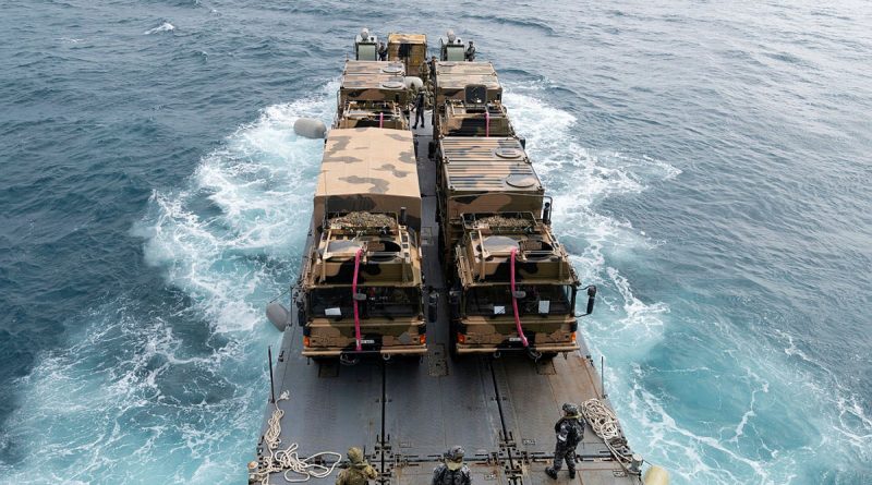 HMAS Choules launches its mexefloat with Australian Army MAN HX77 trucks embarked to conduct amphibious operations as part of Exercise Talisman Sabre. Story by Lieutenant Tahlia Merigan. Photo by Leading Seaman Lauren Pugsley.
