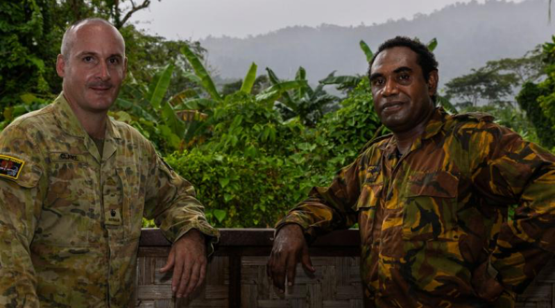 Australian Army officer Major Liam Clarke, from 3rd Combat Engineer Regiment, and Papua New Guinea Defence Force officer Captain Cyril Gerari, from Igam Barracks Engineer Battalion, on Exercise Puk Puk, in Lae, Papua New Guinea. Story by Major Diana Jennings. Photos by Lance Corporal Caitlyn Davill.