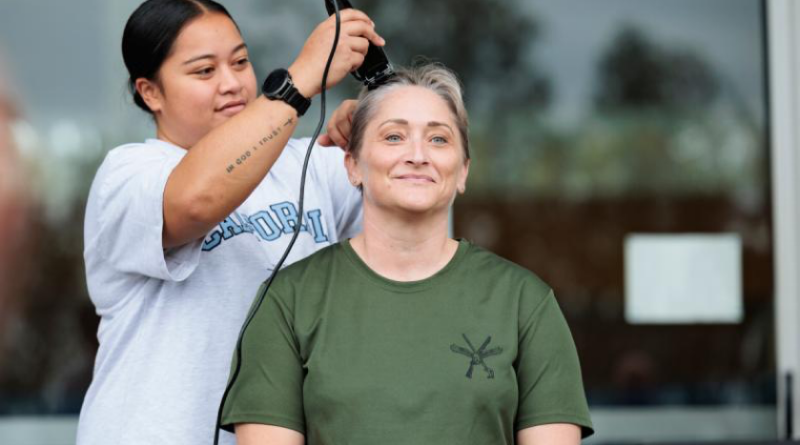 Executive Officer of 2 Security Forces Squadron, Squadron Leader Tai Kohn, has her head shaved after the squadron completed 3521 laps around the RAAF Base Amberley running track to raise funds to fight ovarian cancer. Story by Corporal Sam Price. Photos by Leading Aircraftwoman Taylor Anderson.