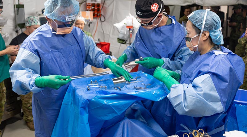 Australian Army soldiers from the 2nd Health Battalion work inside the Role 2 Echo Field Hospital in Shoalwater Bay Training Area, during exercise Talisman Sabre 2025. Photo by Captain Chris Wade.