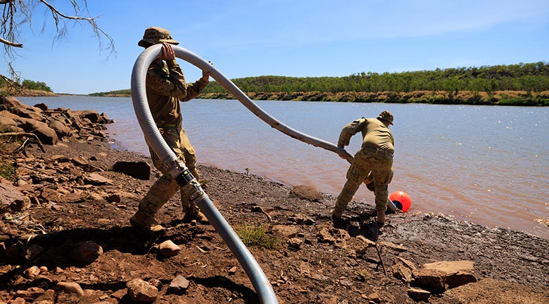 Australian Army soldiers from 1st Combat Engineer Regiment extract water for desalination and purification from Victoria River in the Northern Territory during Exercise Talisman Sabre 2025. Photo by Corporal Madhur Chitnis.