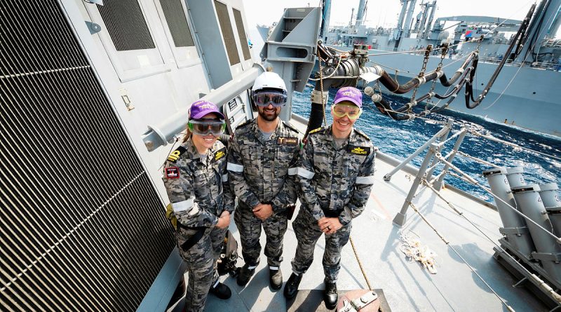 From left, Lieutenant Hannah Roberts, Petty Officer Matthew Samson and Lieutenant Commander James Stahlhut on board HMAS Sydney during a replenishment at sea with Japanese Ship Mashu. Story by Lieutenant Hinako Shiraishi. Photos by Leading Seaman David Cox.