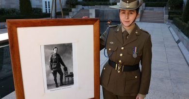 Signaller Ashlee Chivers with a photo of her great-grandfather’s cousin, Sergeant Henry 'Harry' James Chivers, at the Australian War Memorial. Story and photos by Warrant Officer Class 2 Max Bree.