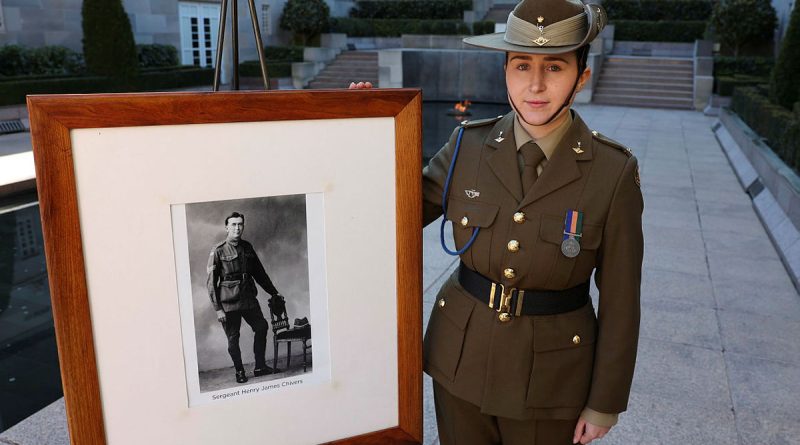 Signaller Ashlee Chivers with a photo of her great-grandfather’s cousin, Sergeant Henry 'Harry' James Chivers, at the Australian War Memorial. Story and photos by Warrant Officer Class 2 Max Bree.
