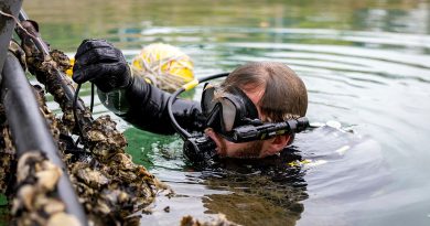 A Royal Australian Navy clearance diver prepares a subsurface improvised explosive device for disposal as part of a training scenario at Gladstone Marina during Exercise Talisman Sabre 25. Story and photo by Corporal Michael Rogers.