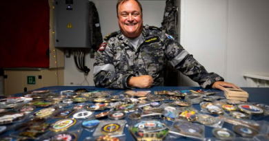 Leading Seaman Adam Hamburger with the impressive trove of coins he collected during HMAS Sydney's regional presence deployment in the Indo-Pacific region. Story by Lieutenant Hinako Shiraishi. Photo by Leading Seaman David Cox.