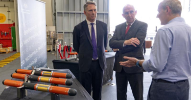 Australian Deputy Prime Minister and Defence Minister Richard Marles and UK Secretary of State for Defence John Healey with Dr Michael Sharp at a Defence Science and Technology Group display on board HMS Prince of Wales. Photo by Jay Cronan.