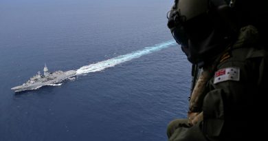 Leading Seaman Aircrewman Jess Muir observes HMAS Ballarat during a South China Sea transit as part of Regional Presence Deployment 25-4. Story by Sub-Lieutenant Jake Badior. Photo by Petty Officer Jacob Kambanaros.