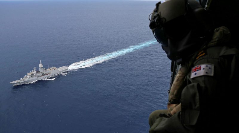 Leading Seaman Aircrewman Jess Muir observes HMAS Ballarat during a South China Sea transit as part of Regional Presence Deployment 25-4. Story by Sub-Lieutenant Jake Badior. Photo by Petty Officer Jacob Kambanaros.