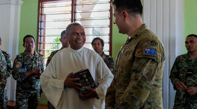 Australian Army Chaplain Cesar Lopez gifts a priest with some Holy Bibles at a Local Parish Church at Comoro in Dili, Timor, during Indo-Pacific Endeavour 2025. Story by Lieutenant Marcus Middleton. Photos by Leading Aircraftwoman Nell Bradbury.