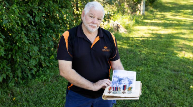 Defence APS member Grant Tebbutt with his late grandfather Tom Foster’s recently recovered World War 2 medals and a photo album belonging to his father, Ivan. Story by Lieutenant Fenlan Miller. Photos by Lance Corporal Luke Donegan.