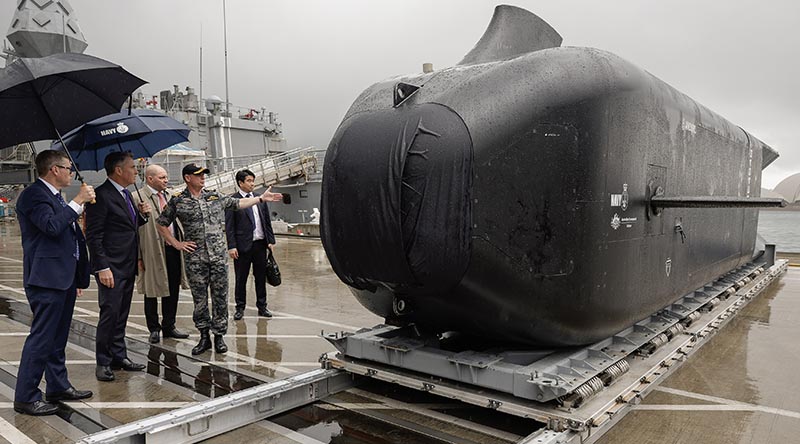 Minister for Defence Richard Marles and Minister for Defence Industry Pat Conroy at at Fleet Base East in Sydney, inspect a Ghost Shark prototype before announcing the contract with Anduril Australia to acquire a new fleet of Australian designed and built extra-large autonomous undersea vehicles – known as Ghost Sharks – for the Royal Australian Navy. ADF photo by Kym Smith.