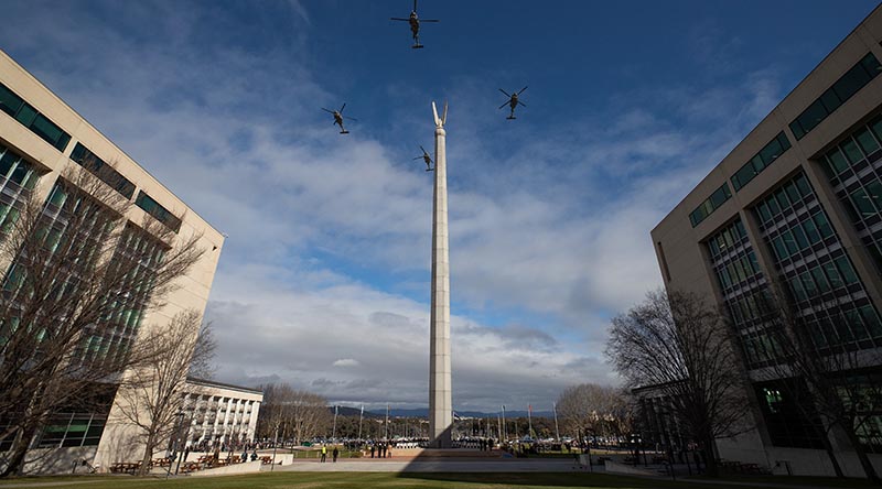 Four MH60R Romeo Seahawk helicopters from the Royal Australian Navy's 725 Squadron and 816 Squadron fly overhead Blamey Square, Russell Offices, Canberra. ADF photo by Kym Smith.