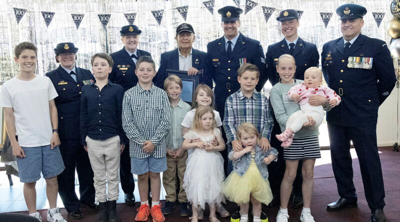 Phillip 'Monro' Preuss celebrates his century with his great-grandchildren and 1 Recruit Training Unit members, from left, Squadron Leader Shannon Monk, Wing Commander Jodie Mason, Sergeant Nick Harrison, Corporal Tahlia Stockley and Warrant Officer David Harding. Story and photos by Flying Officer Belinda Barker.