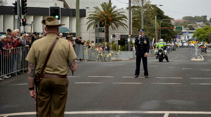 Major Anthony Bartlett is halted by Queensland Police Service Darling Downs District Officer, Superintendent Doug McDonald, for the ‘challenge’ during a freedom-of-entry march through Toowoomba. Story by Captain Cody Tsaousis. Photo by Private Alli Craig.