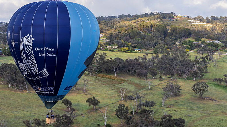 The Air Force Balloon with Mount Panorama in the background at 2025 Repco Bathurst 1000. Story by Flying Officer Belinda Barker. Photos by Sergeant Dan Pinhorn.