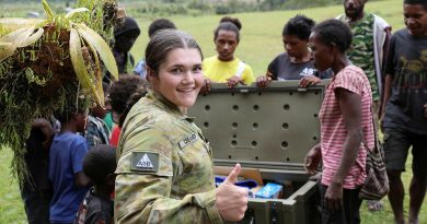 Trooper Megan Creamer helps deliver donated goods during a community outreach activity in the Papua New Guinea Central Highlands village of Kosipe during Exercise Helicon Luk. Story and photos by Captain Tadek Markowski.
