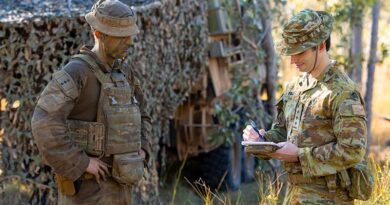Captain Manning Field (right) from Battle Lab talks with Captain Thomas James from the 2nd/14th Light Horse Regiment (QMI) during Exercise Talisman Sabre 2025. Photo by Sergeant Dustin Anderson.