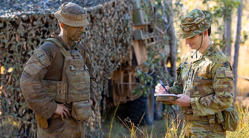 Captain Manning Field (right) from Battle Lab talks with Captain Thomas James from the 2nd/14th Light Horse Regiment (QMI) during Exercise Talisman Sabre 2025. Photo by Sergeant Dustin Anderson.