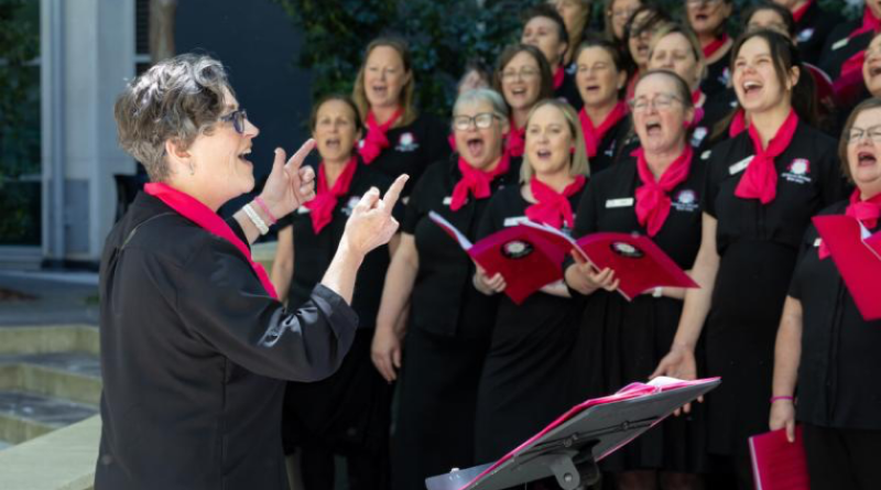 The Australian Military Wives Choir deliver a heartfelt performance for staff in the Russell Offices courtyard, Canberra. Story by Corporal Jacob Joseph. Photos by Nicholas Haggarty.