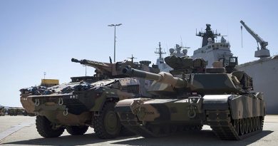 An Australian Army Boxer combat reconnaissance vehicle (left) and an M1A2 SEPv3 Abrams main battle tank during sea-transportability trials at Townsville Port, Queensland. Photo by Lance Corporal Caitlyn Davill.