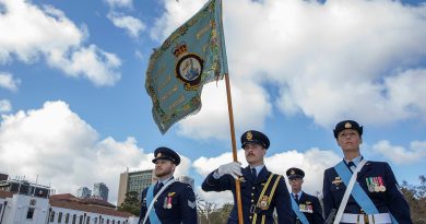 The Colour Party presents the 9 Squadron Standard as a Bell UH-1 Iroquois helicopter conducts a flyover at the Torrens Parade Ground in Adelaide to mark the squadron’s reformation. Story by Flying Officer Shanea Zeegers. Photo by Flight Sergeant Rob Hack.