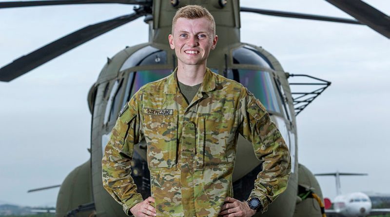 Australian Army Craftsman Marcus Szewczuk, of the 5th Aviation Regiment, stands before an Australian Army CH-47F Chinook in PNG. Story by Captain Tadek Markowski. Photos by Corporal Dana Millington.