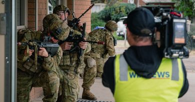 A TV crew films Australian soldiers as they conduct clearance operations as part of Exercise Arras Walk. Photo by Captain Mark Blackman.