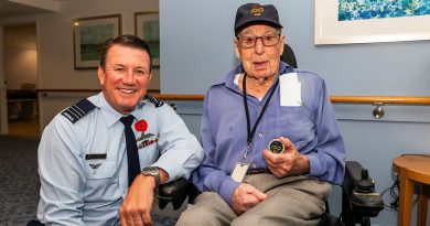 Commanding Officer 100 Squadron Wing Commander Richard Brougham presents a 100 Squadron challenge coin to James Birt. Story and photos by Flying Officer Michael Thomas.