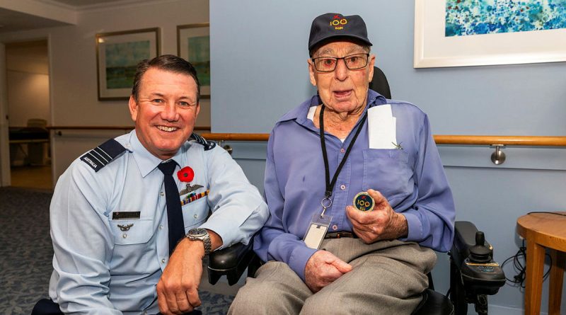 Commanding Officer 100 Squadron Wing Commander Richard Brougham presents a 100 Squadron challenge coin to James Birt. Story and photos by Flying Officer Michael Thomas.