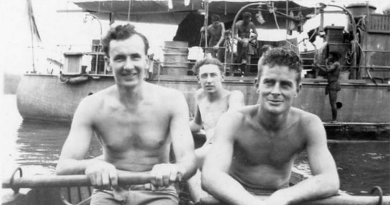 Then-Able Seaman Ross Gourlay, centre, heads towards HMAS Martindale anchored at Kiriwina Island, Papua New Guinea, 1944. Story by Corporal Jacob Joseph.