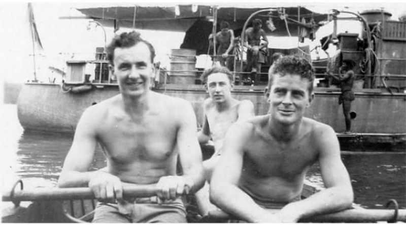 Then-Able Seaman Ross Gourlay, centre, heads towards HMAS Martindale anchored at Kiriwina Island, Papua New Guinea, 1944. Story by Corporal Jacob Joseph.