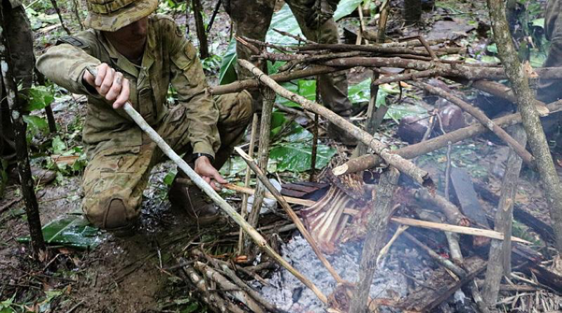 Australian Army Sapper Nicholas Carmont cooks food during a jungle survival course in the Philippines on Exercise Kasangga. Story by Warrant officer Class 2 Max Bree. Photos by Armed Forces of the Philippines.