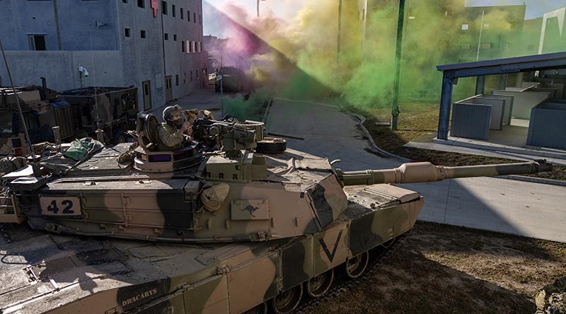 An Australian Army M1A2 SEPv3 Abrams main battle tank provides support for soldiers during an urban assault at Shoalwater Bay Training Area as part of Exercise Talisman Sabre 25. Photo by Corporal Michael Rogers.