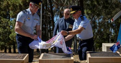 Royal Australian Air Force officers Air Commodore Adam Spinks, left, and Air Commodore Bill Hayden unveil the Australian Armourers Association plaque at the RAAF Memorial Grove, Canberra. Story and photos by Corporal Michael Rogers.