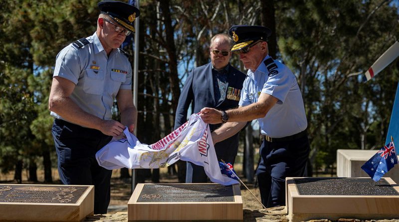 Royal Australian Air Force officers Air Commodore Adam Spinks, left, and Air Commodore Bill Hayden unveil the Australian Armourers Association plaque at the RAAF Memorial Grove, Canberra. Story and photos by Corporal Michael Rogers.