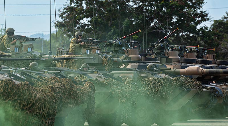 Australian Army soldiers from 2nd Cavalry Regiment perform a counter attack demonstration during the T4 (D Squadron) Raising Ceremony at Lavarack Barracks, Townsville, Queensland. Photo by Private essica Gray.