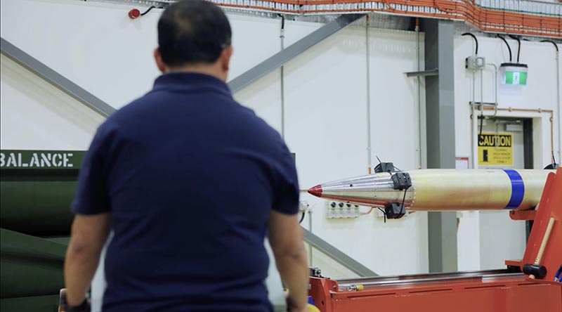 A Lockheed Martin employee handling a HIMARS missile at Port Wakefield. Lockheed Martin video screen grab.