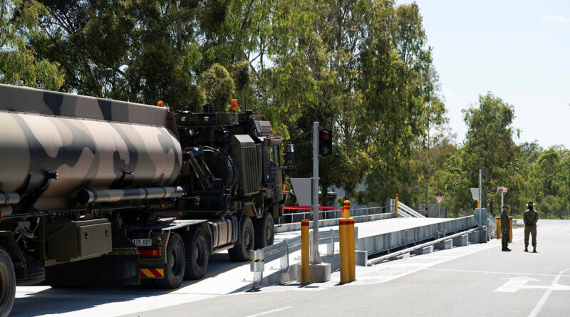An Army HX81 truck pulls a water tanker to demonstrate the new weighbridge at RAAF Base Amberley. Story by Warrant Officer Class 2 Max Bree. Photos: byPrivate Mikayla Abson.