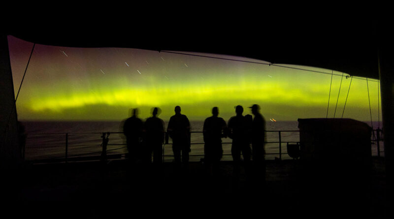 Sailors from HMAS Warramunga gather on the upper deck to view the colours of the Aurora Australis. Story by Sub-Lieutenant Keigan Gunther. Photos by Leading Seaman Abdus Chowdhury.