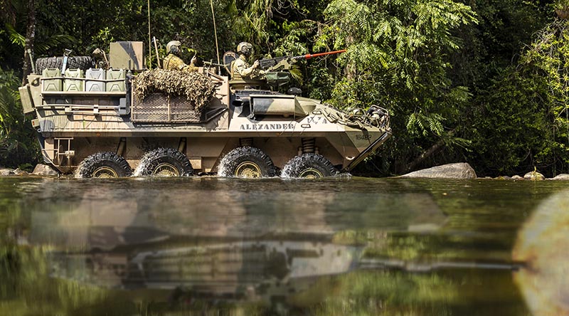 An Australian Army light armoured vehicle from 2nd Cavalry Regiment conducts a river crossing during Exercise Regional Warfighter at Tully Training Area, Queensland. Original hoto by Corporal Jack Pearce, digitally altered by CONTACT.