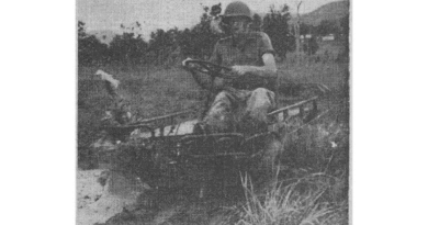 A soldier rides a Mechanical Mule in a 1960 photo from the Australian Army newspaper, now digitised through Trove.